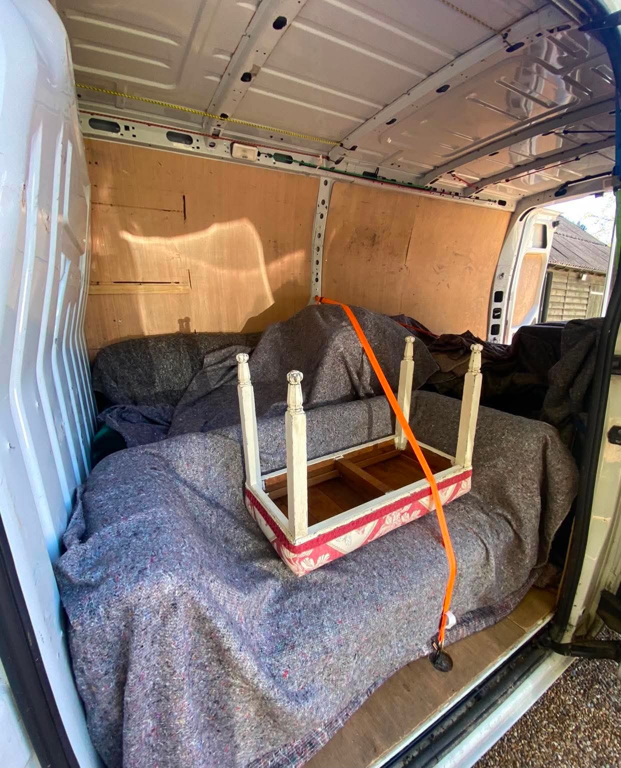 Bradley's Removals team carefully moving furniture in a Hastings home
